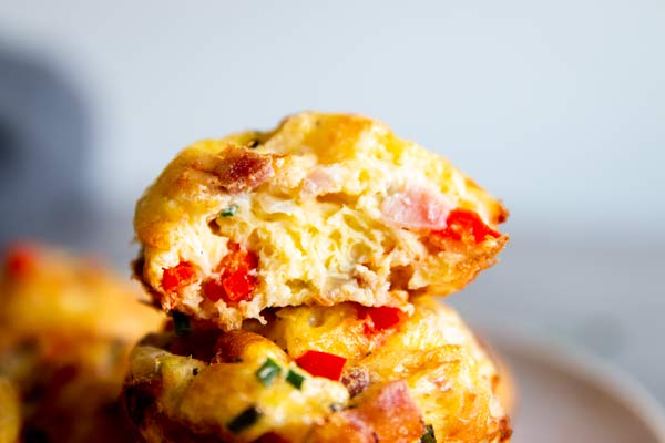 halved egg breakfast muffin with bacon and cheese