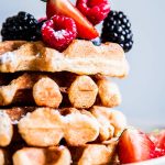 stack of healthy waffles topped with berries