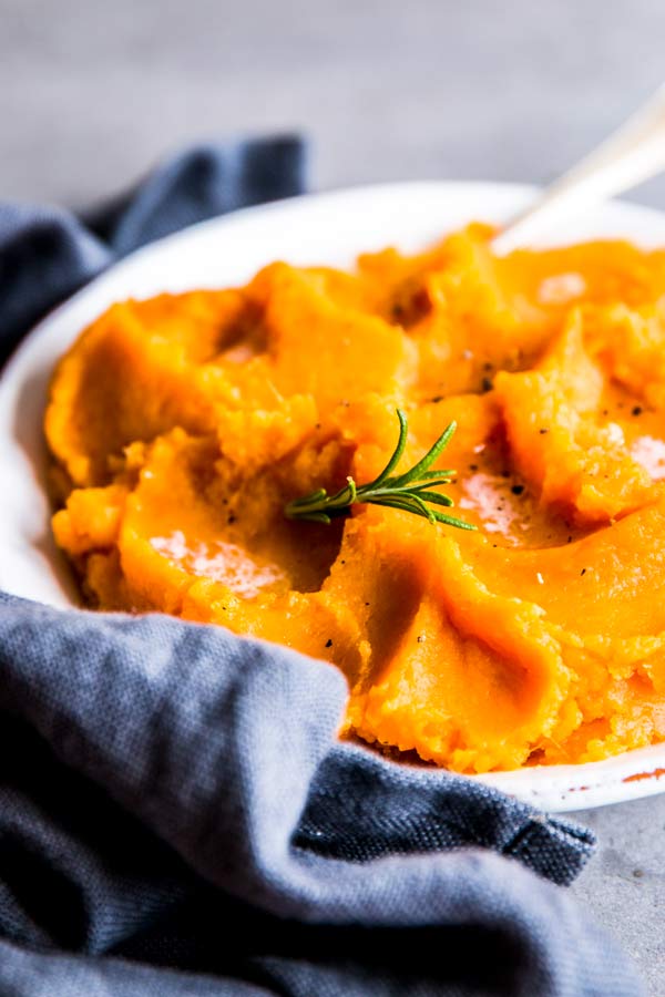 mashed sweet potatoes on a plate with a napkin