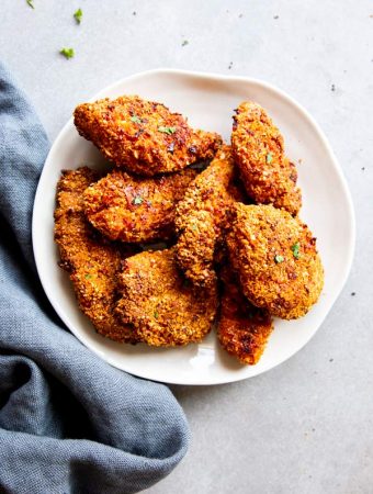 low carb oven fried chicken on a white plate
