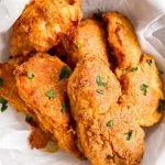 close up photo of low carb oven fried fish in a white bowl