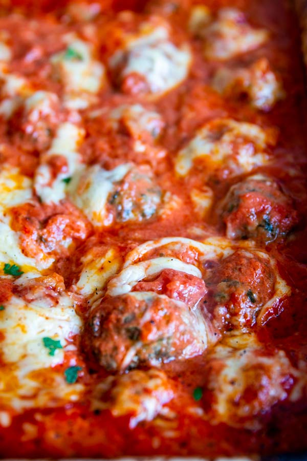 close up photo of low carb cheesy meatball casserole