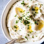 mashed cauliflower in a white bowl