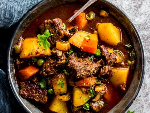 slow cooker beef stew in a black bowl
