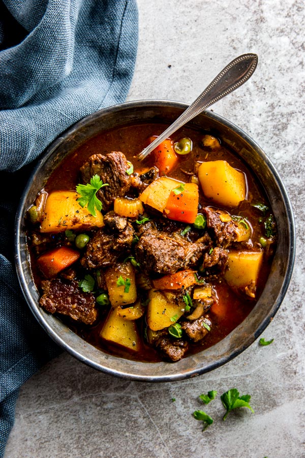 slow cooker beef stew in a black bowl