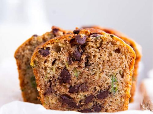 sliced healthy chocolate chip zucchini bread on a wooden chopping board