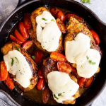 black cast iron skillet with balsamic glazed caprese chicken