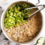 top down view on skillet with zucchini ribbons and keto stroganoff