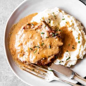 plate with smothered pork chops