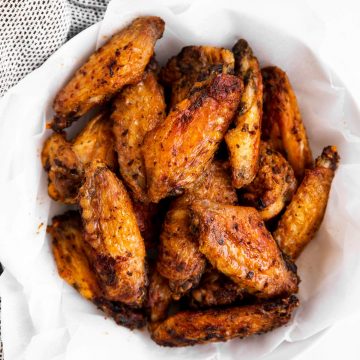 overhead view of chicken wings in a white bowl