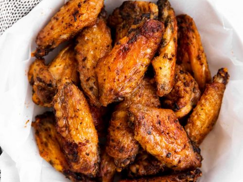 overhead view of chicken wings in a white bowl