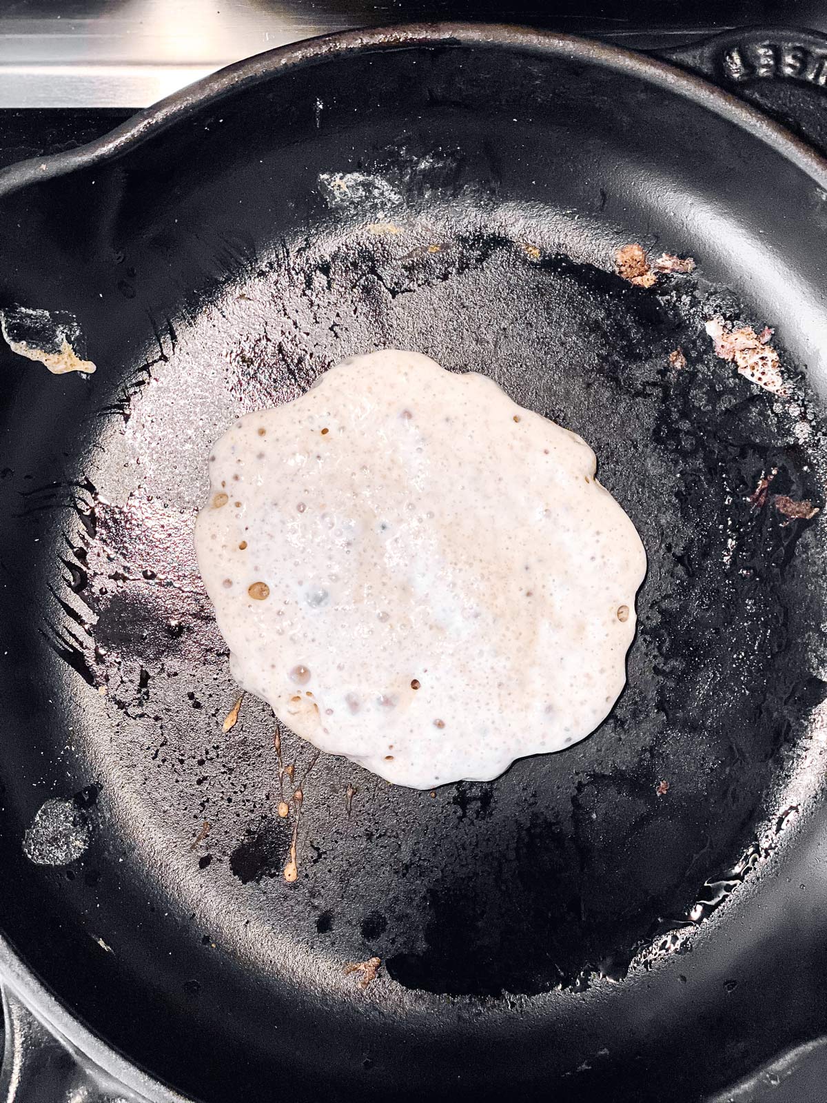 pancakes batter in cast iron pan